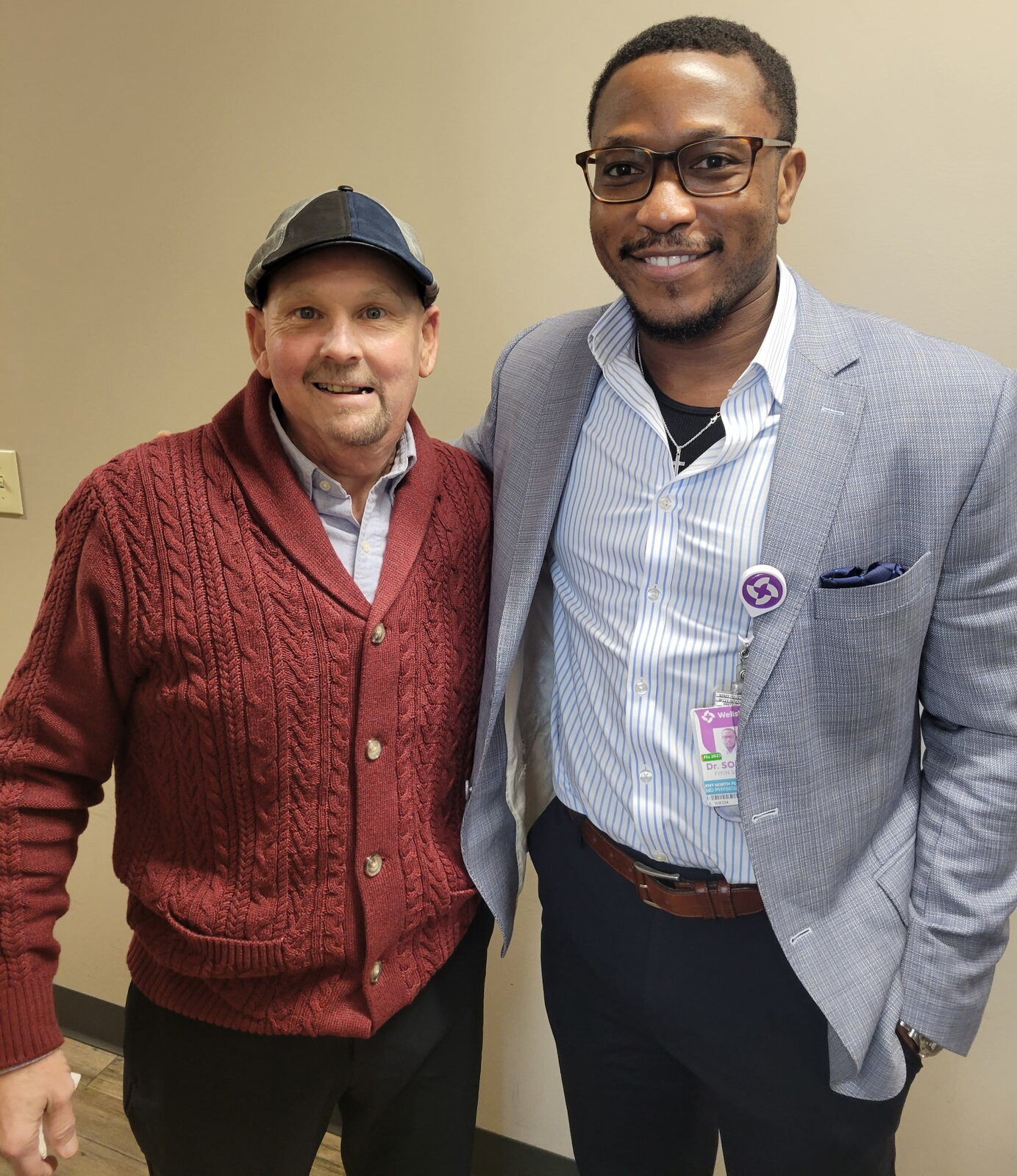 David standing with Dr. Sokoya, a member of his medical care team