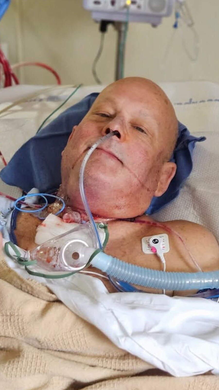David resting in a hospital bed during recovery