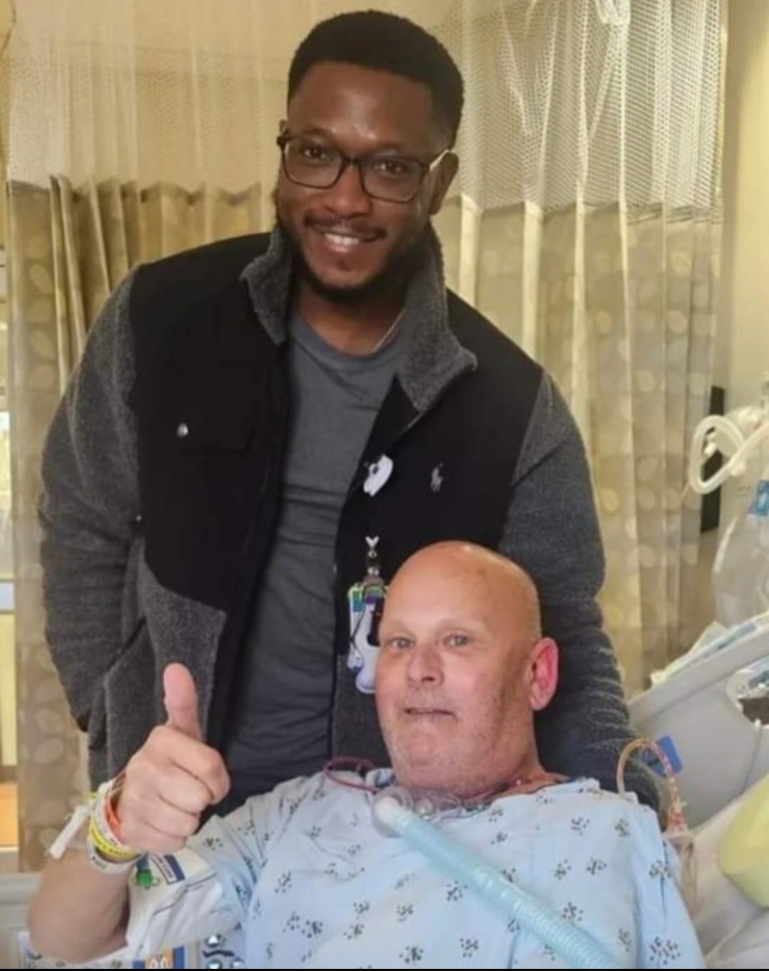 David giving a thumbs up with Dr. Sokoya during recovery