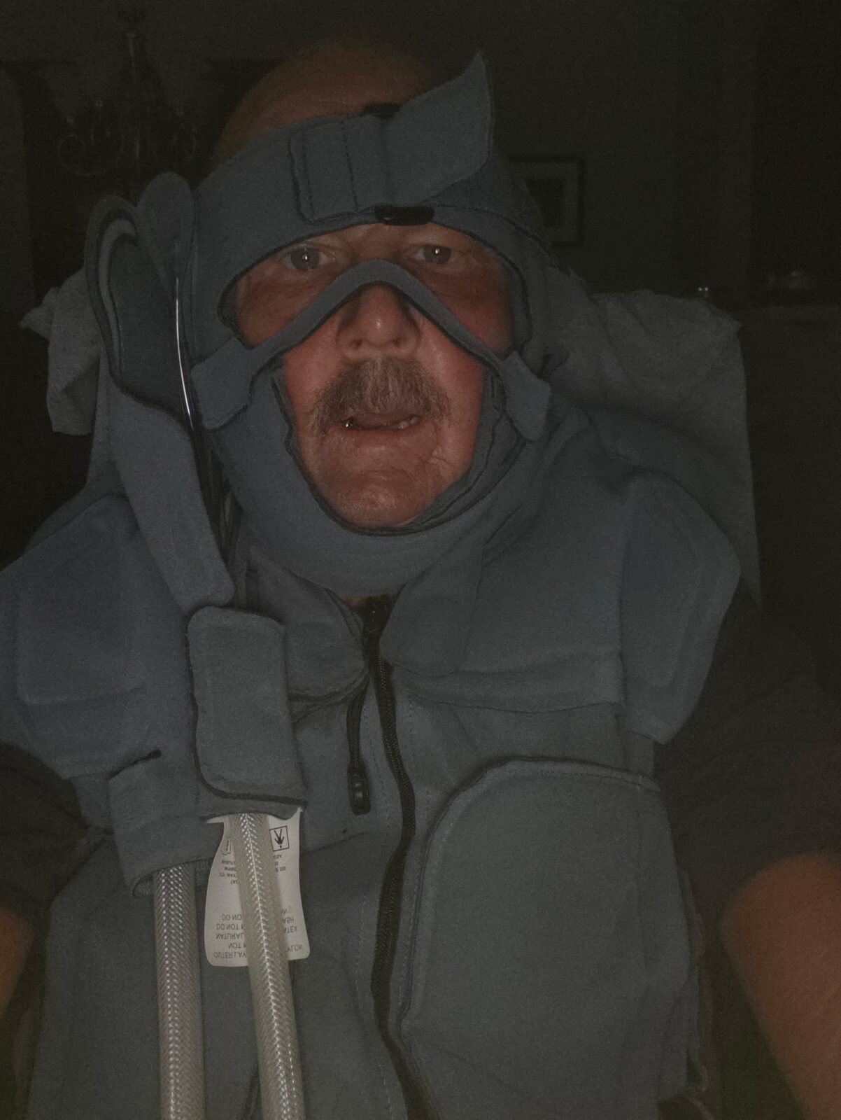 David wrapped in a medical warming blanket during treatment